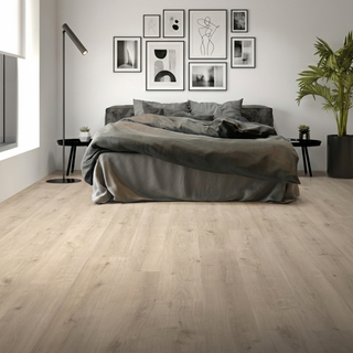 This modern bedroom features Sequoia’s light ash-oak flooring, showcasing soft gray-beige undertones and subtle grain movement for a clean, contemporary look. The wide-plank design enhances the spacious feel of the room, pairing effortlessly with minimalist décor, monochromatic bedding, and black accent furniture. Durable, waterproof, and low-maintenance, Sequoia flooring delivers both style and performance—perfect for bedrooms, high-rise apartments, and modern homes seeking a calm, refined aesthetic.