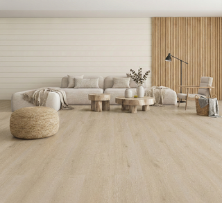 This bright, minimalist living room features Sequoia’s pale natural oak flooring, showcasing soft beige undertones and subtle grain movement for a clean Scandinavian look. The light wide-plank design enhances the airy feel of the space and pairs beautifully with modern neutral furniture, rounded sofas, and natural wood accents. Sequoia flooring creates a warm yet contemporary foundation, ideal for homes seeking a spacious, calming aesthetic with durable, low-maintenance performance.